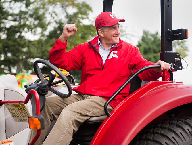 President Barchi aboard a tractor